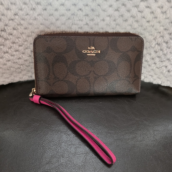 Coach Handbags - Coach Signature Brown Wristlet with Pink Strap